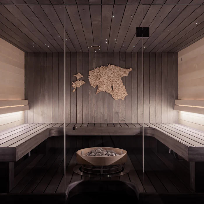 Warm wooden steam room with soft ambient lighting